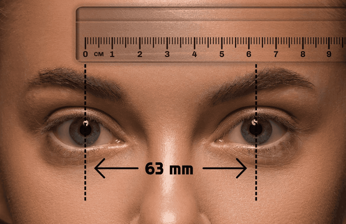 Pupillary distance measured between the centers of the pupils with a ruler held across the brow